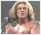 Edge holding Triple H's sledgehammer