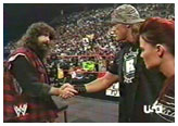 Edge and Lita shaking hands with Mick Foley